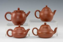 FOUR CHINESE MINIATURE YIXING TEAPOTS & COVERS, three of squat bellied form, the largest of barrel