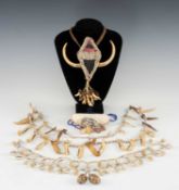 FOUR SHELL OR BEAD NECKLACES, Papua New Guinea, one incorporating nassa shells, woven fibre and