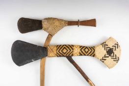 TWO CURRENCY AXES, Papua New Guinea, one with decorative rattan woven haft, both with inset flat