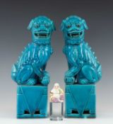 PAIR CHINESE TURQUOISE GLAZED PORCELAIN BUDDHISTIC LIONS, or Dogs of Fo, on draped plinths, 29.