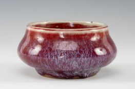 CHINESE SANG-DE-BOEUF PORCELAIN CENSER, of bombé form on short foot, 11.5cms (diam.) Provenance: