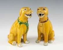 PAIR OF CHINESE SANCAI GLAZED PORCELAIN FIGURES OF HOUNDS, late Qing Dynasty, seated with open