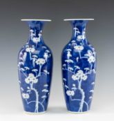 PAIR OF CHINESE BLUE & WHITE PORCELAIN VASES, slender oviform with flared rims, painted with