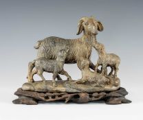 CHINESE CARVED GREYSTONE GROUP OF SHEEP, on naturalistic base, wood stand, 20cms (w) Provenance: