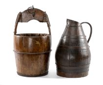 TWO COOPERED VESSELS, comprising a water ewer and a well-bucket, largest 58cms (h) (2) Provenance: