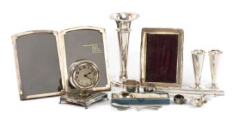 ASSORTED SILVERWARE including desk clock, three stemmed vases, napkin ring, butter knife, teaspoon