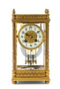 LATE 19TH C. FRENCH GILT BRASS MANTEL CLOCK, architectural case, bevelled glass, Roman dial, eight-