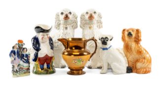 PAIR OF VICTORIAN STAFFORDSHIRE SPANIELS, 33cms (h); together with a further Staffordshire