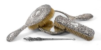 SILVER-BACKED HAIRBRUSH, repoussé decoration of birds, flowers, scrolls, and mask head, 27.5 (h) x