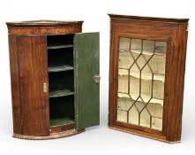 GEORGIAN MAHOGANY CORNER CUPBOARDS, bow front two-door cupboard with brass escutcheons and painted