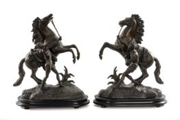 PAIR OF VICTORIAN SPELTER MARLY HORSES after Coustou, mounted on wooden bases, 43cms (h) Provenance: