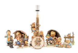 SMALL COLLECTION OF HUMMEL FIGURES, including umbrella boy and girl, table lamp, and others (14)
