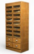 WITHY GROVE STORES OAK HABERDASHERY CABINET, having 20 drawers, 16 with glazed fronts, all with