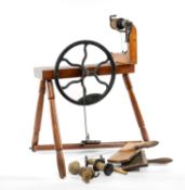 TRADITIONAL SPINNING WHEEL & CARDING PADDLES, contained within a vintage suitcase Provenance: