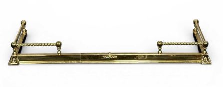 ADJUSTABLE BRASS FENDER, 14 (h) x 134cms (w) (smallest) x 44cms (d) Provenance: private collection