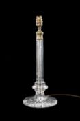 VINTAGE CRYSTAL TABLE LAMP with octagonal column and circular star-cut base, gilded brass