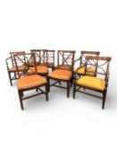 FOUR REGENCY MAHOGANY DINING CHAIRS, c. 1810, comprising carver and three singles; together with two