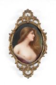 HEUBACH HAND-PAINTED PORCELAIN PLAQUE 'ODALISKE', mounted in a pressed brass frame, 14 x 8cms