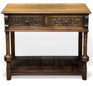EDWARDIAN OAK TWO-DRAWER CONSOLE TABLE, with lower shelf, on turned and block supports, 77 (h) x