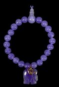 LAVENDER JADEITE BEAD BRACELET, with elephant charm Provenance: private collection Ynys Môn