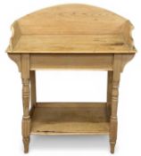 19TH CENTURY PINE WASHSTAND, having arched rail back and sides, turned frontal supports united to an