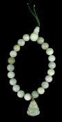 GREEN JADEITE BEAD BRACELET, with Buddha charm Provenance: private collection Ynys Môn