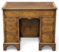 WALNUT KNEEHOLE DESK, having rectangular top with tooled inset leather writing surface over frieze