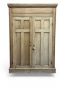 VINTAGE PINE WARDROBE, moulded cornice over two panel doors with knob handle, on platform base,