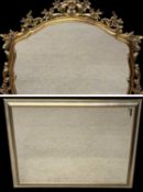 TWO LARGE WALL MIRRORS, an ornate example, 116 (h) x 123 (w) x 5cms (d); and a silver-coloured