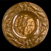 NEWLYN SCHOOL ARTS & CRAFTS CIRCULAR COPPER CHARGER, the border with repoussé decoration of maritime