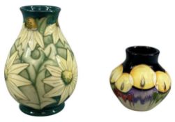 TWO MOORCROFT VASES, Summer Lawn pattern, 14cms (h), boxed, and Candle pattern, 8cms (h) Provenance: