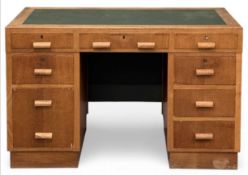 MID-CENTURY TYPE LIGHT WOOD TWIN PEDESTAL DESK, with tooled top and label 'Matthews & Son,