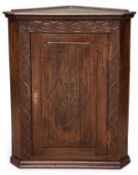 ANTIQUE OAK SINGLE-DOOR WALL-HANGING CORNER CUPBOARD, 99 (h) x 82 (w) x 45cms (d) Provenance: