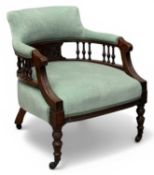 EDWARDIAN UPHOLSTERED TUB CHAIR, spindle and upholstered back, on turned supports with castors,