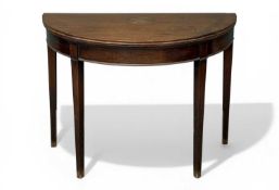 19TH CENTURY MAHOGANY DEMI-LUNE CARD TABLE, fold-over top with lined interior, on tapered square