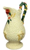 CLARICE CLIFF CELTIC HARVEST JUG, moulded with wheat sheaves on a honey glaze ground, the handle