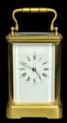 GILDED BRASS-CASED FOUR-GLASS CARRIAGE CLOCK, with chime, 14cms (h) Provenance: private collection