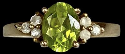 9CT GOLD RING, centre oval citrine with clear stones to shoulders, size O, 3.1g Provenance: