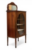 EDWARDIAN MAHOGANY INLAID DISPLAY CABINET the single door having glazed oval, with mirrored rail-