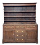 LATE 18TH CENTURY OAK WELSH DRESSER, three-shelf shaped rack above base with T-arrangement of six