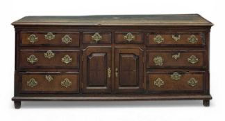 18TH CENTURY OAK DRESSER BASE, possibly English-Welsh borders, multiple drawers with brass drop