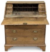 VICTORIAN OAK BUREAU, having drop-down surface over three drawers with brass drop handles and