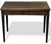 EDWARDIAN MAHOGANY FOLD-OVER TEA TABLE, on tapered supports, 73 (h) x 91 (w) x 46cms (d) Provenance: