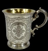 VICTORIAN SILVER CHRISTENING MUG, bead rim, floral and scroll engraved decoration, ornate loop