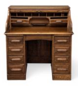 EDWARDIAN OAK ROLL TOP DESK by The Feige Desk Company, 111 (h) x 107 (w) x 66cms (d) Provenance: