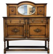 COMPACT EDWARDIAN OAK MIRROR-BACK SIDEBOARD, with two drawers and two doors, on barley-twist