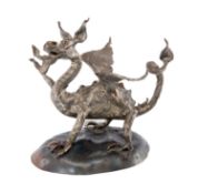 TOM HUGHES wrought metal - sculpture of a Welsh dragon, signed and dated '80, on oval base, 21cms (