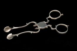 GEORGE III SILVER SUGAR NIPS, Thomas Wallis, London c. 1780, with scallop shell bowls, scrolled