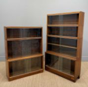 TWO MID-CENTURY OAK 'MINTY' FREE-STANDING BOOKCASES, sliding glass doors, both with labels, four-