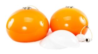 TWO HARVEY GUZZINI STYLE MID-CENTURY ORANGE PENDANT LAMPSHADES, with associated diffusers, approx.